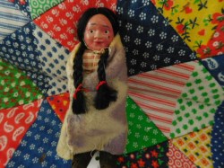 5'' VINTAGE CELLULOID FACE SKOOKUMS, BROWN FEET, WOOL BLANKET